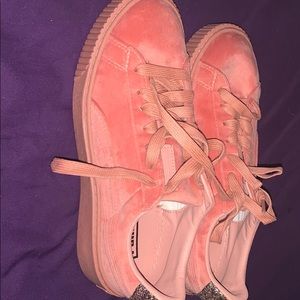 All pink suede pumas.